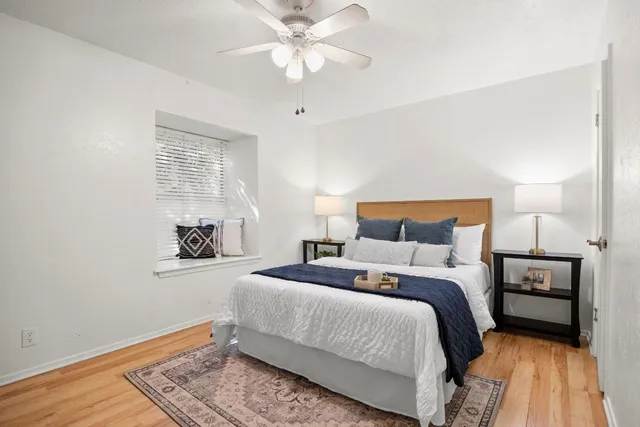 a bedroom with a bed and a window