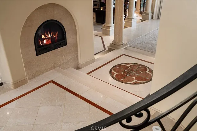 a view of an empty room with wooden floor and a floor to ceiling window