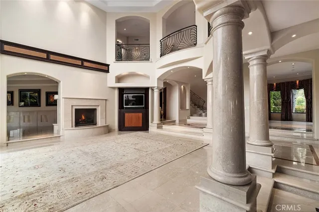 a kitchen with stainless steel appliances granite countertop a stove refrigerator and cabinets