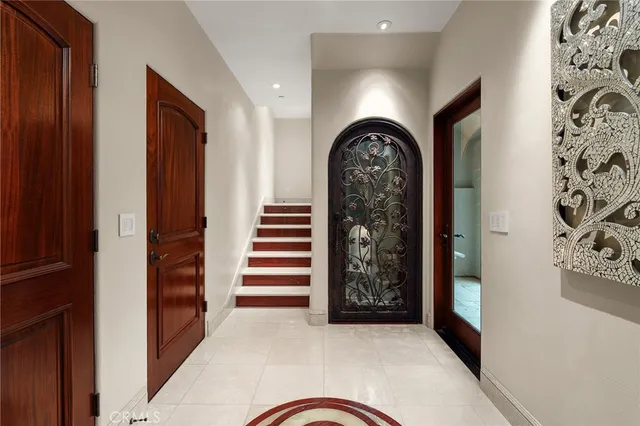 a bedroom with a large bed and a large window