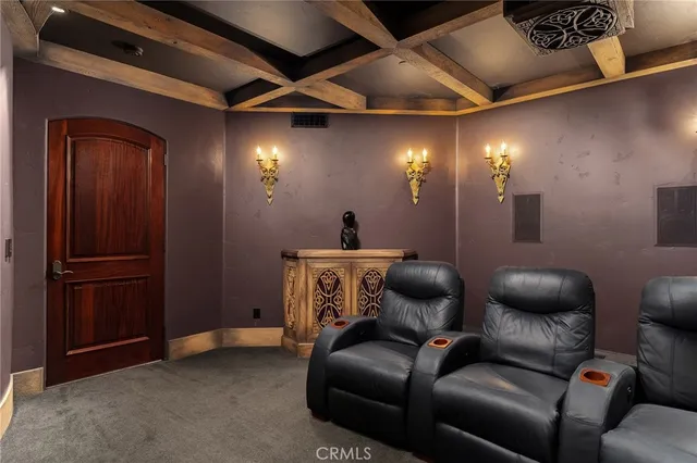 a bathroom with a glass shower door and mirror