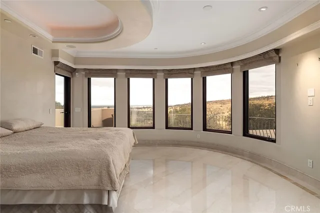 a bathroom with a granite countertop sink and a window