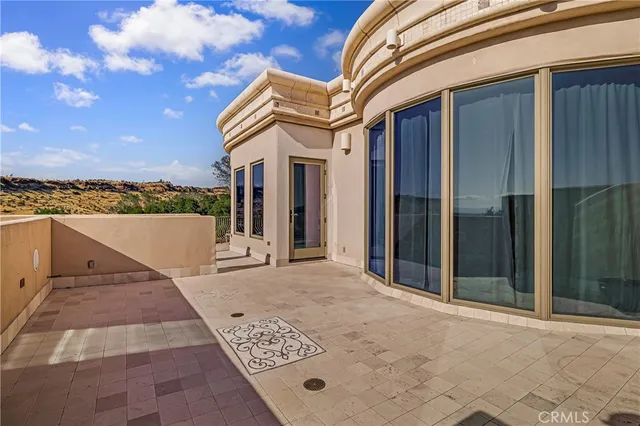 a front view of a house with a yard table and chairs
