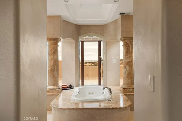 a view of a house with swimming pool next to a yard