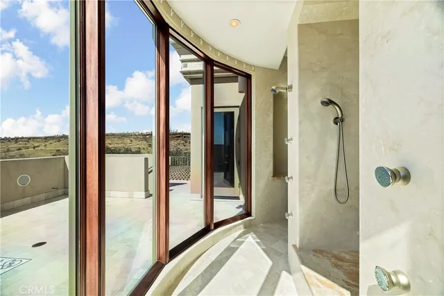 a front view of a house with a garden and yard