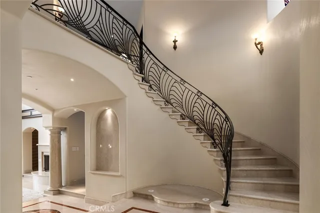 a view of a livingroom with wooden floor and windows