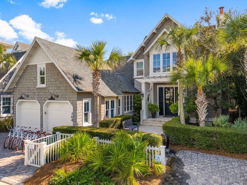 a front view of a house with a yard table and chairs