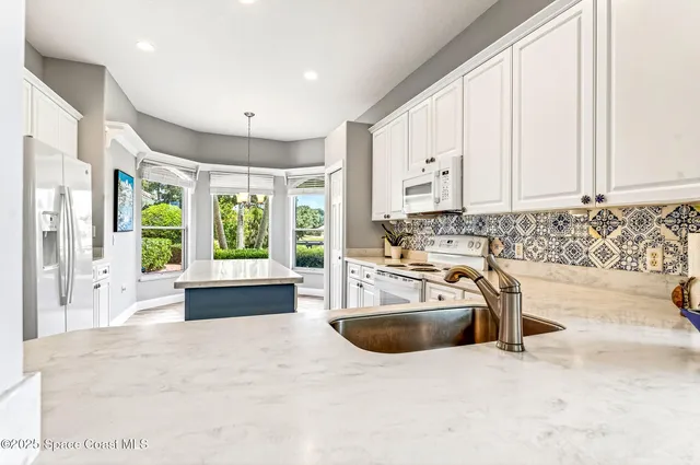 a living room with furniture large window and flat screen tv