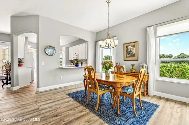 a bedroom with a large bed and a large window