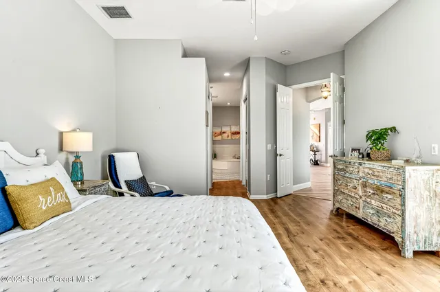 a bedroom with a bed and a dresser