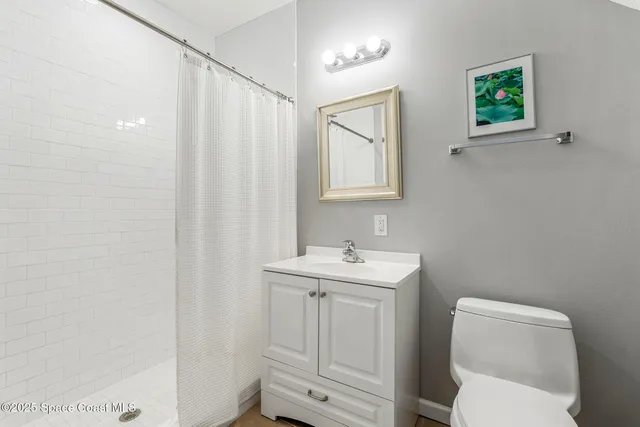 a view of a room with workspace and a window