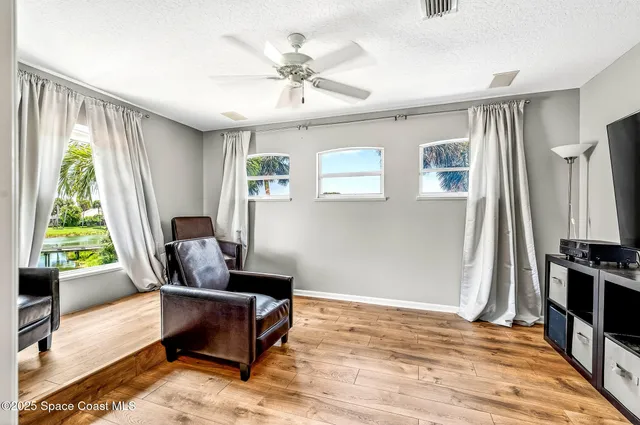 an aerial view of a houses with a lake view