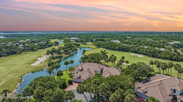 a front view of a house with a yard and a garage