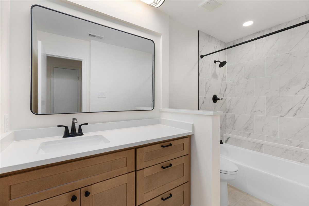 4711 Spicewood Springs Road, Unit 4222 Austin, TX 78759 - Photo 5 of 35 Refinished bathroom with a broad vanity and sleek fixtures.