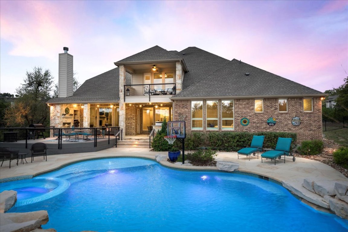 408 Riva Ridge Place Austin, TX 78737 - Photo 1 of 1 a building outdoor space with patio lots of furniture and garden view