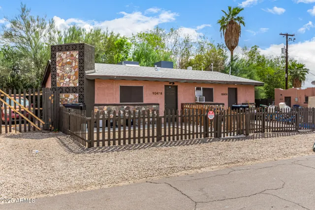 a view of a house with a wooden deck