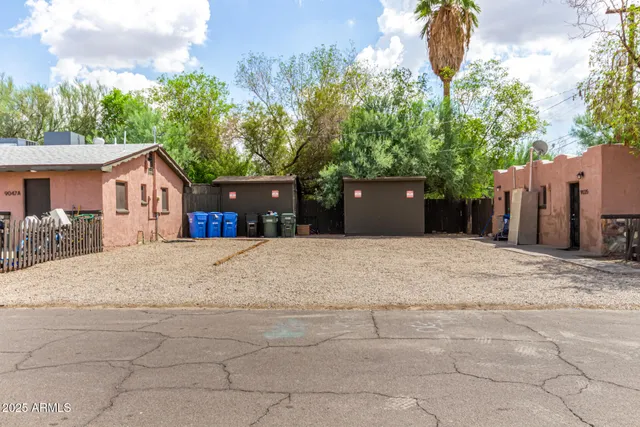 a view of a house with a yard and garage