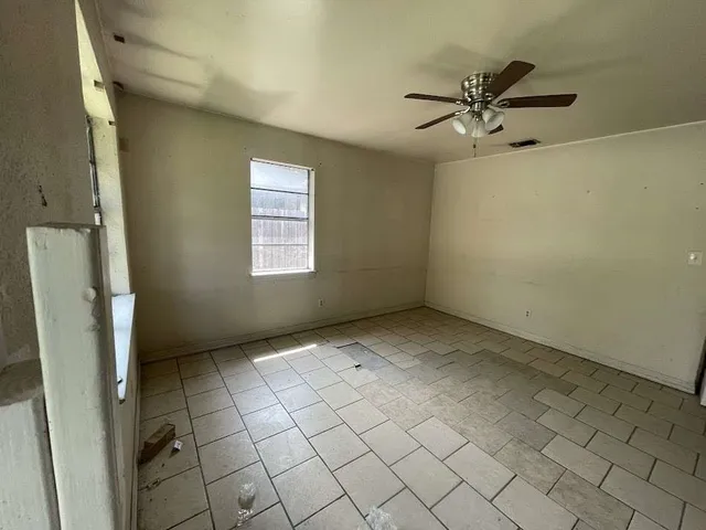 a view of an empty room and window