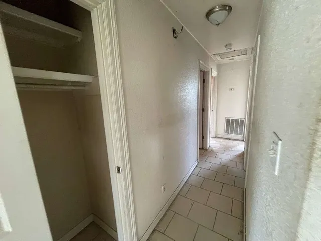 a view of an empty room and window