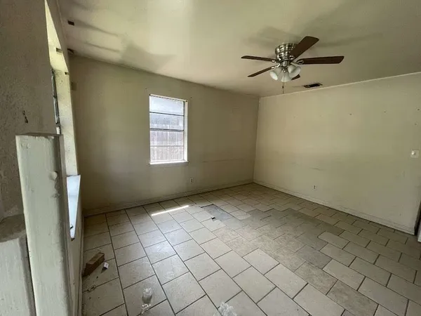 a view of an empty room and window