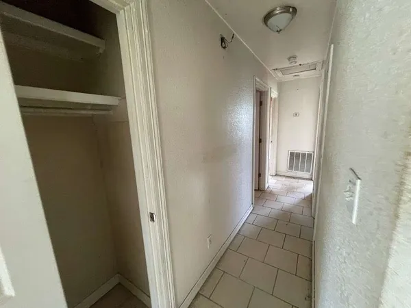 a view of an empty room and window