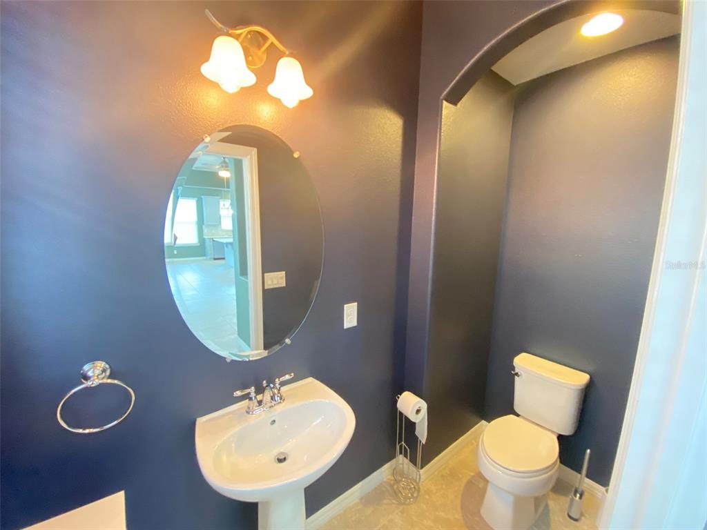 8500 Iron Mountain Trail Windermere, FL 34786 - Photo 12 of 40 a bathroom with a toilet a sink and mirror