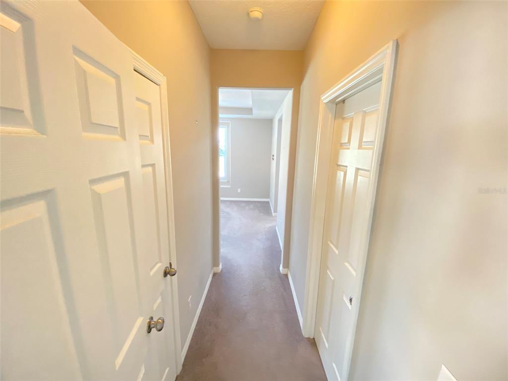 8500 Iron Mountain Trail Windermere, FL 34786 - Photo 13 of 40 a view of a hallway with wooden floor and staircase