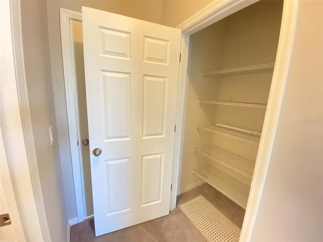 a bathroom with a toilet a sink and a window