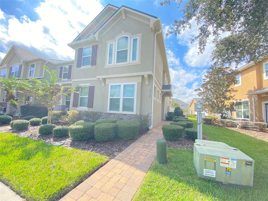 8500 Iron Mountain Trail Windermere, FL 34786 - Photo 2 of 40 a front view of house with yard and green space