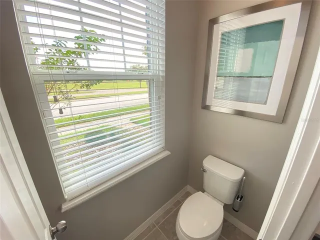 a bathroom with a sink double vanity granite and a mirror