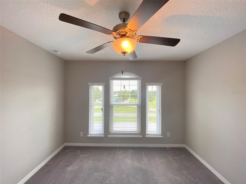8500 Iron Mountain Trail Windermere, FL 34786 - Photo 25 of 40 an empty room with windows and fan