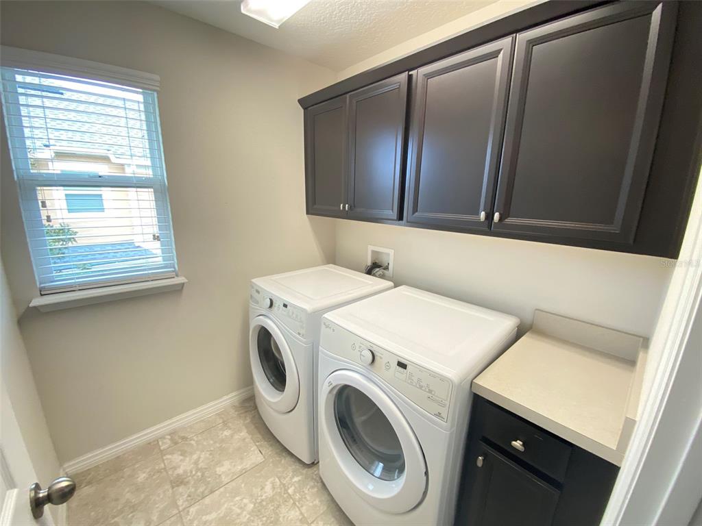 8500 Iron Mountain Trail Windermere, FL 34786 - Photo 28 of 40 a utility room with dryer and washer