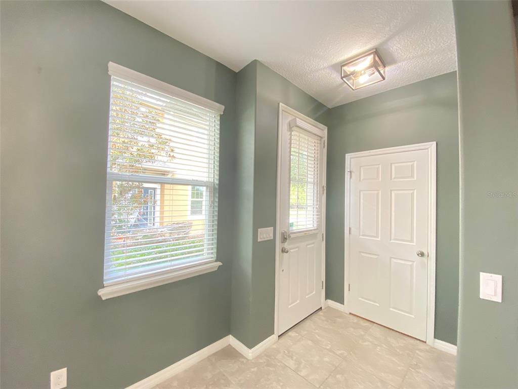 8500 Iron Mountain Trail Windermere, FL 34786 - Photo 7 of 40 a view of an empty room with window and a bathroom