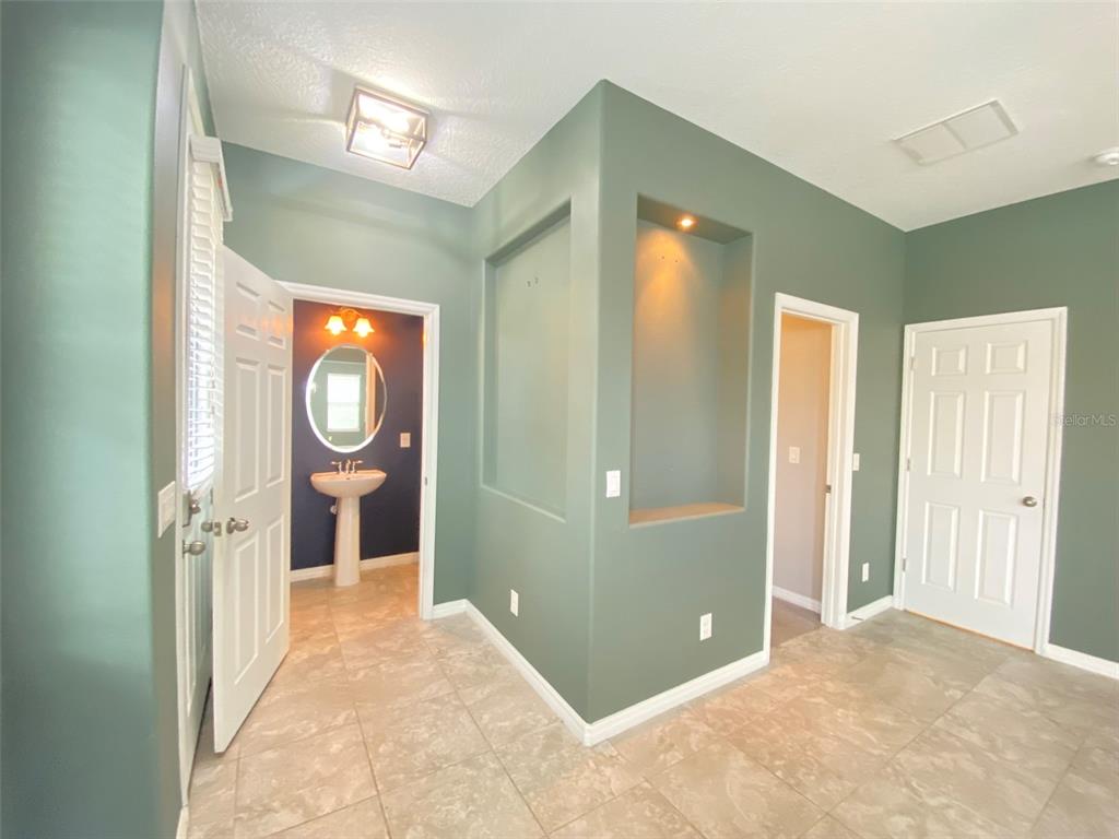 8500 Iron Mountain Trail Windermere, FL 34786 - Photo 8 of 40 a view of a hallway with wooden floor and closet