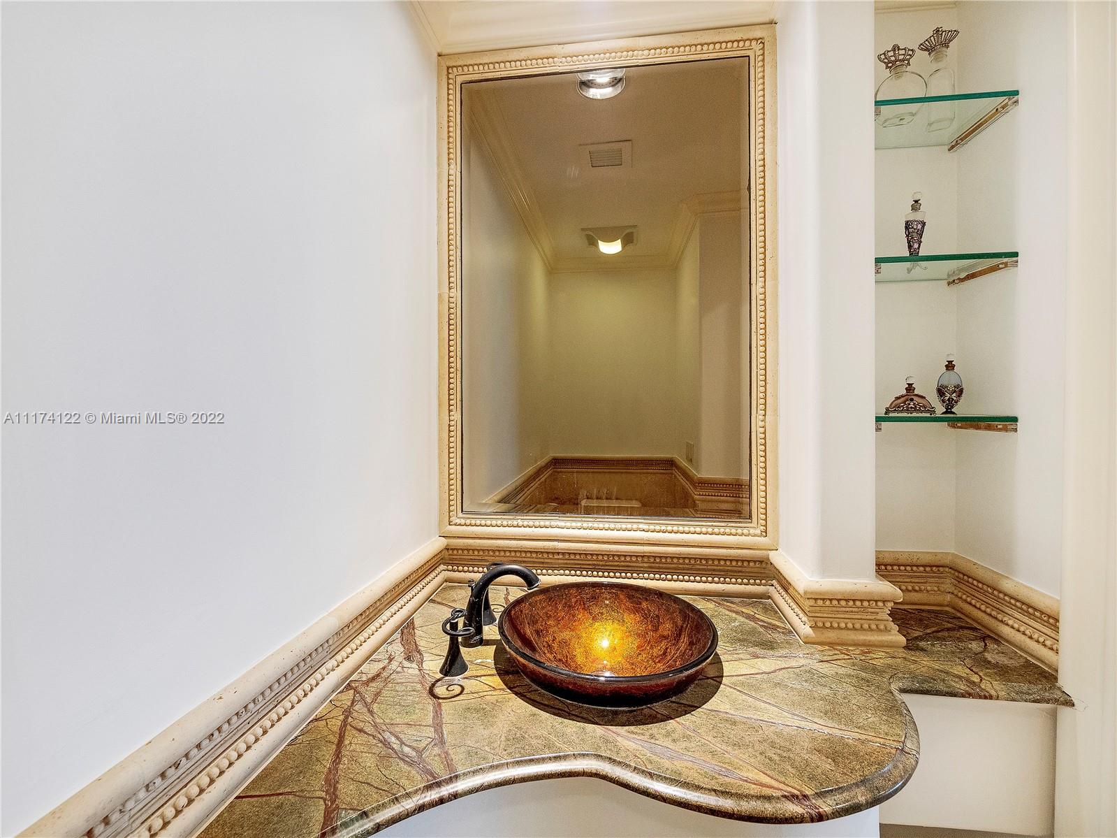 2050 Florida A1A, Unit 2 Jupiter, FL 33477 - Photo 15 of 22 a bathroom with a sink and a mirror