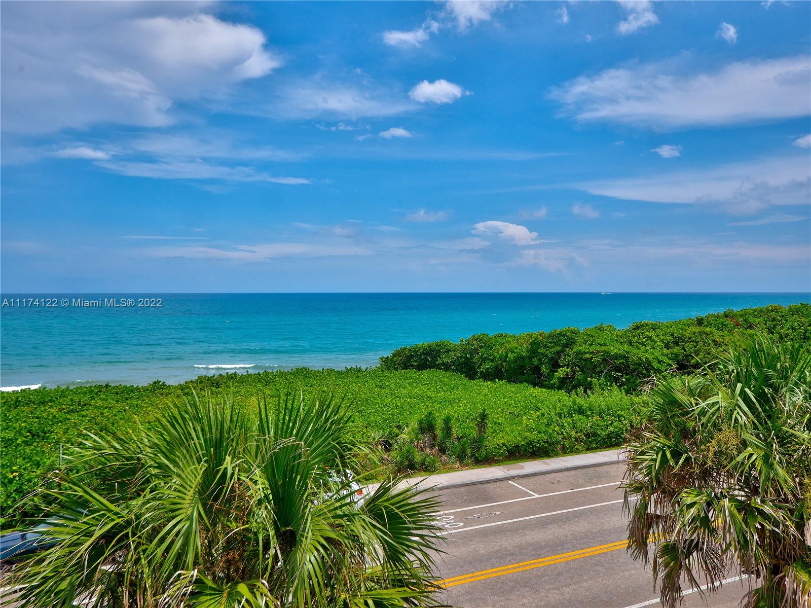 2050 Florida A1A, Unit 2 Jupiter, FL 33477 - Photo 2 of 22 a view of yard with ocean view