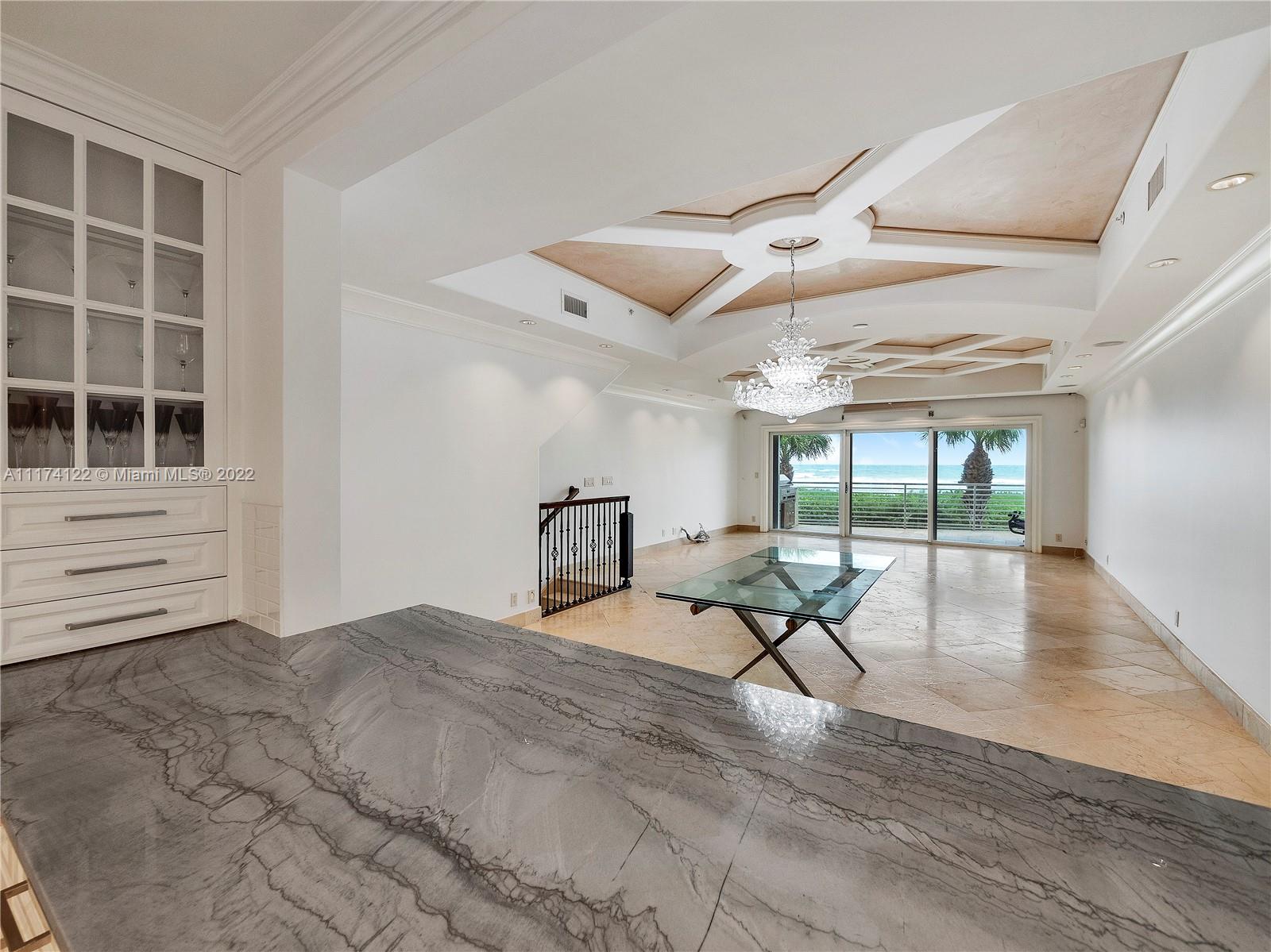 2050 Florida A1A, Unit 2 Jupiter, FL 33477 - Photo 6 of 22 a view of a room with furniture wooden floor and a window