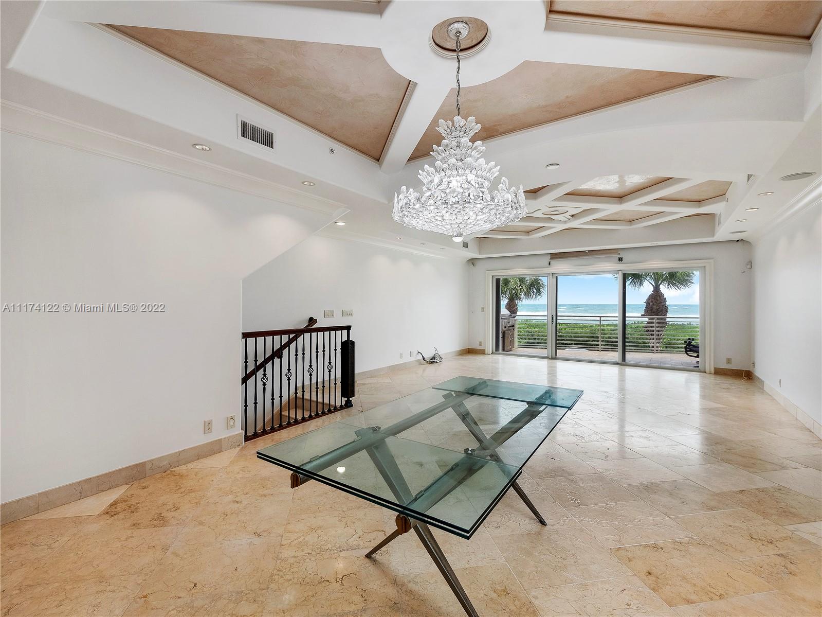 2050 Florida A1A, Unit 2 Jupiter, FL 33477 - Photo 7 of 22 a view of a livingroom with furniture and a chandelier