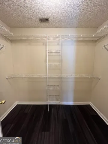 a view of an empty walk in closet