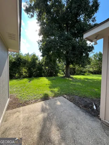 a view of a park with large trees