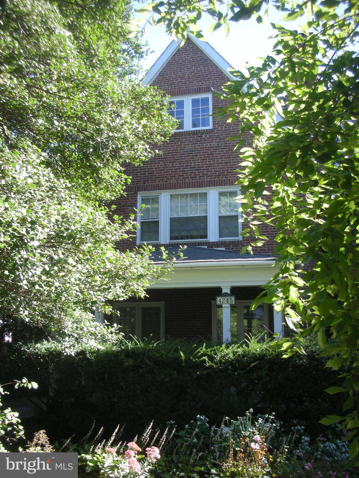 4245 Wickford Road Baltimore, MD 21210 - Photo 1 of 10 a front view of house with yard and green space
