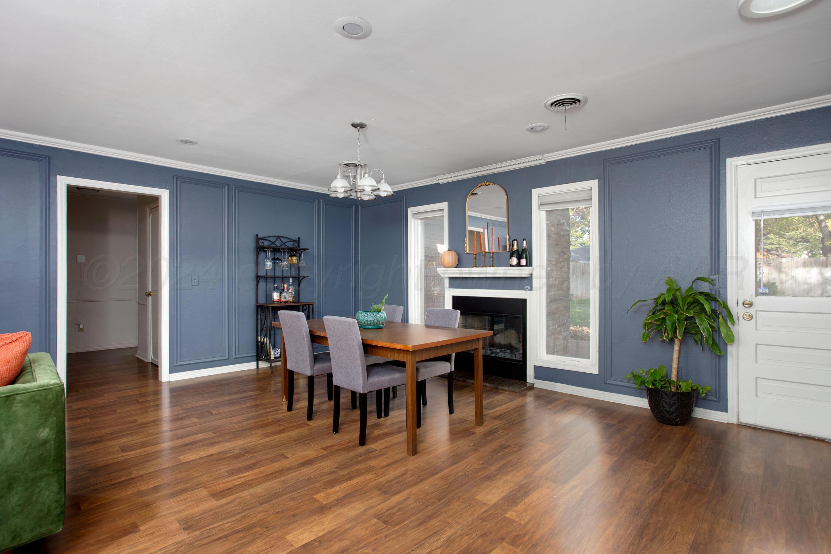 6800 Dreyfuss Road Amarillo, TX 79106 - Photo 7 of 32 a view of a dining room with furniture and wooden floor