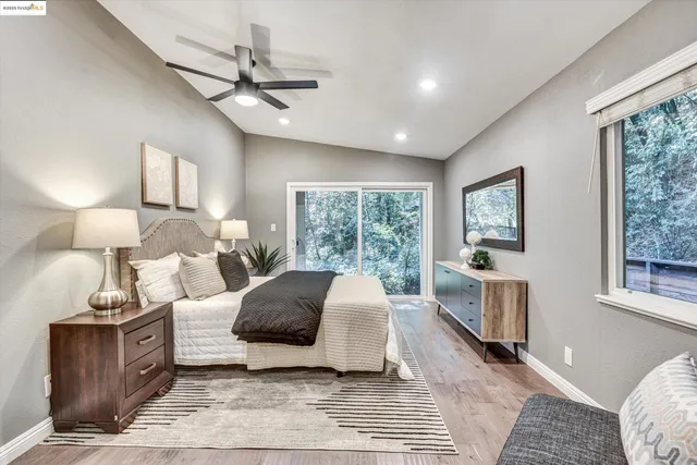 a spacious bedroom with a large bed and a window