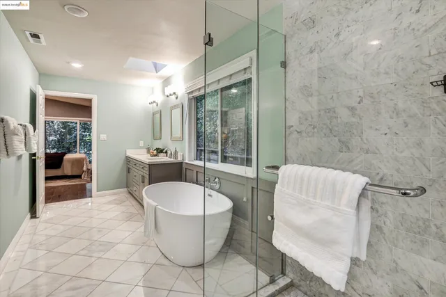 a living room with furniture a table and a potted plant