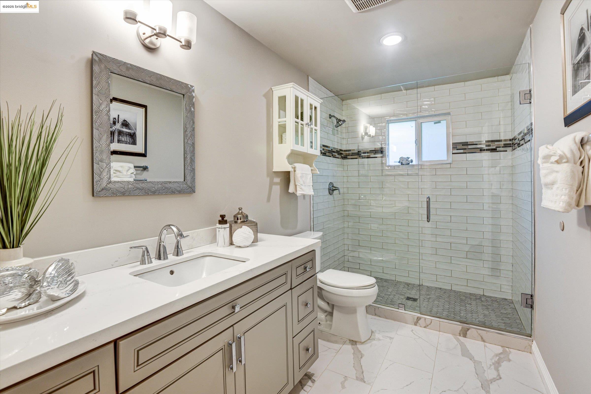 7 St Stephens Drive Orinda, CA 94563 - Photo 18 of 27 a bathroom with a sink a toilet and shower