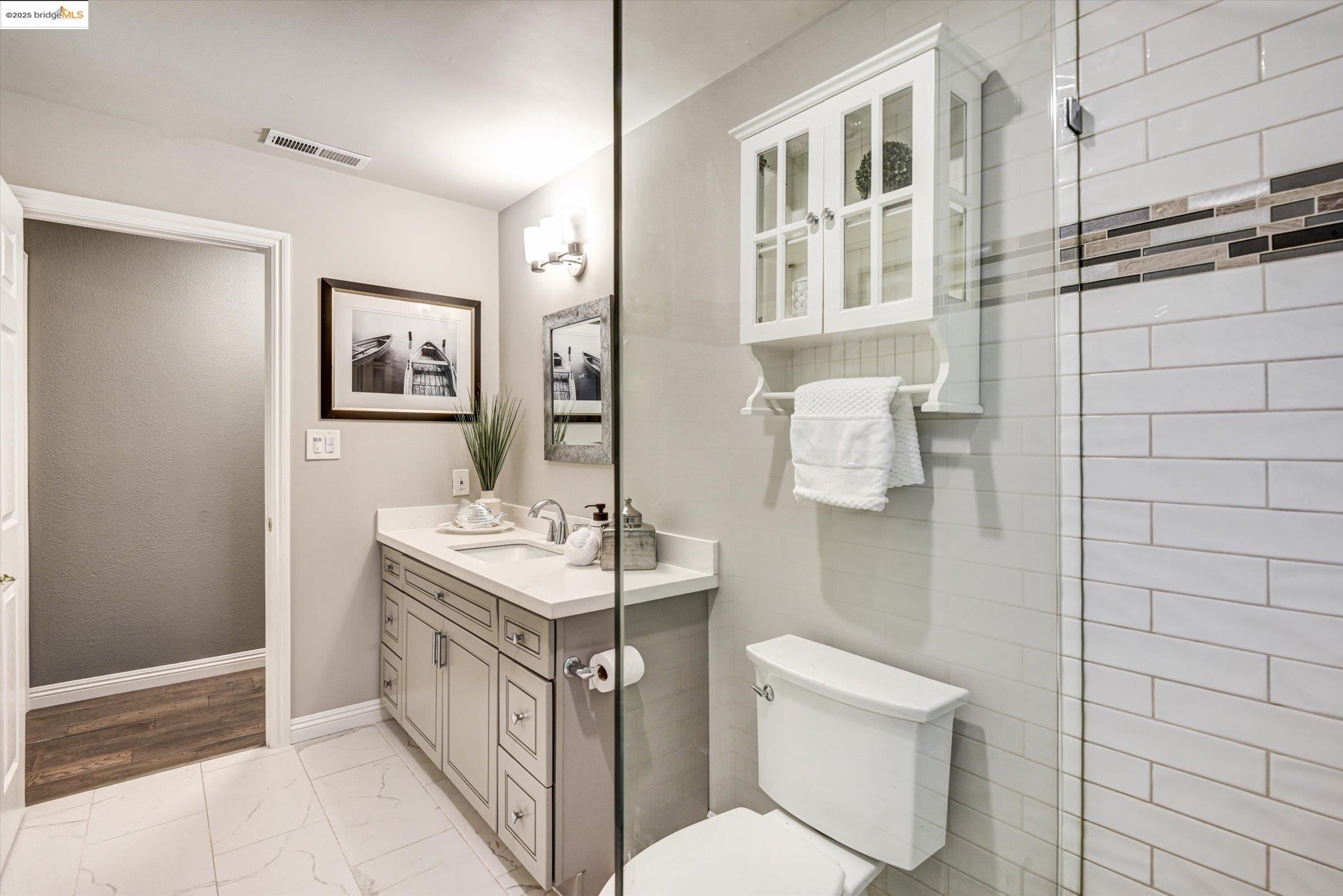 7 St Stephens Drive Orinda, CA 94563 - Photo 19 of 27 a bathroom with a sink a toilet and shower