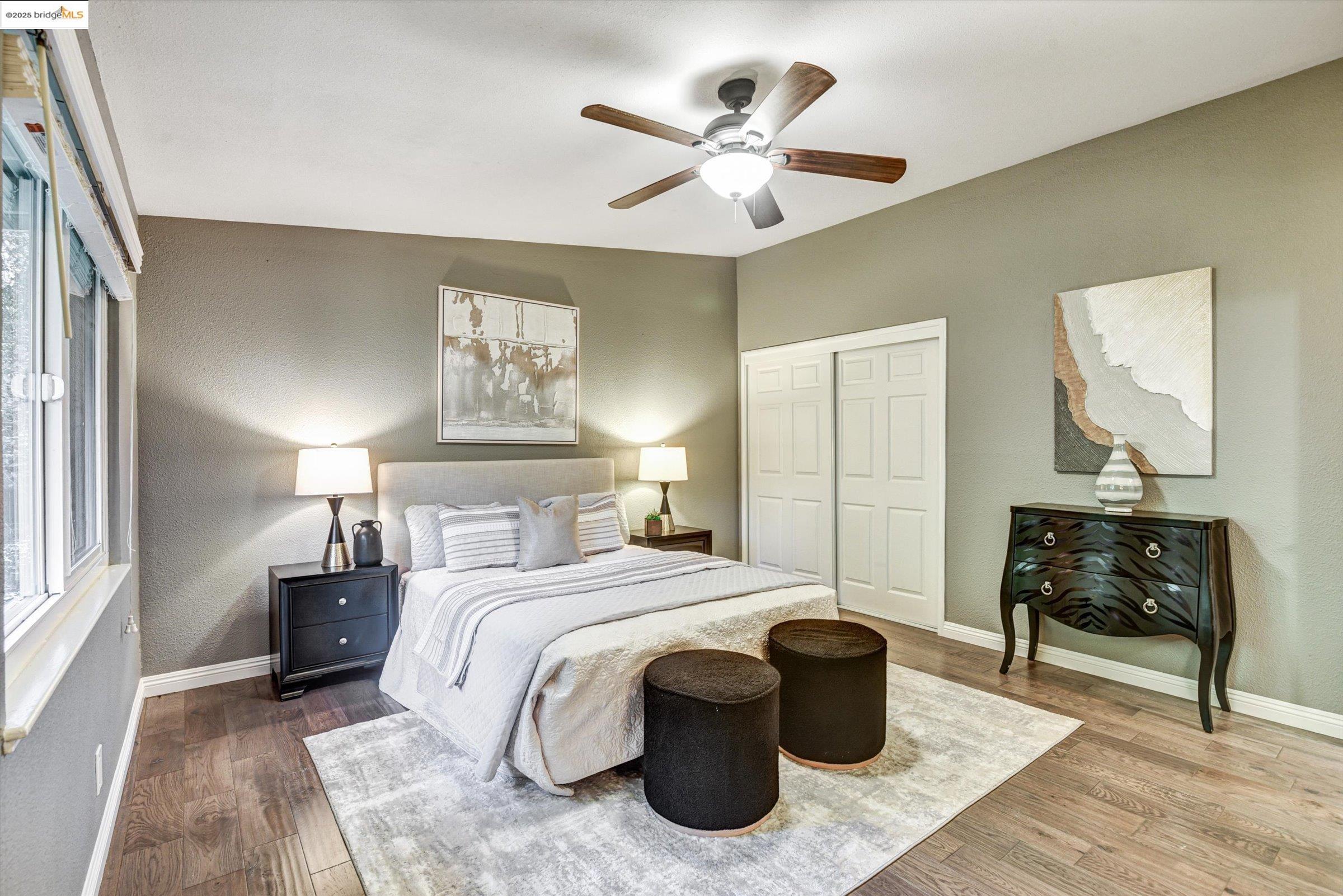 7 St Stephens Drive Orinda, CA 94563 - Photo 21 of 27 a bedroom with a bed and a chandelier