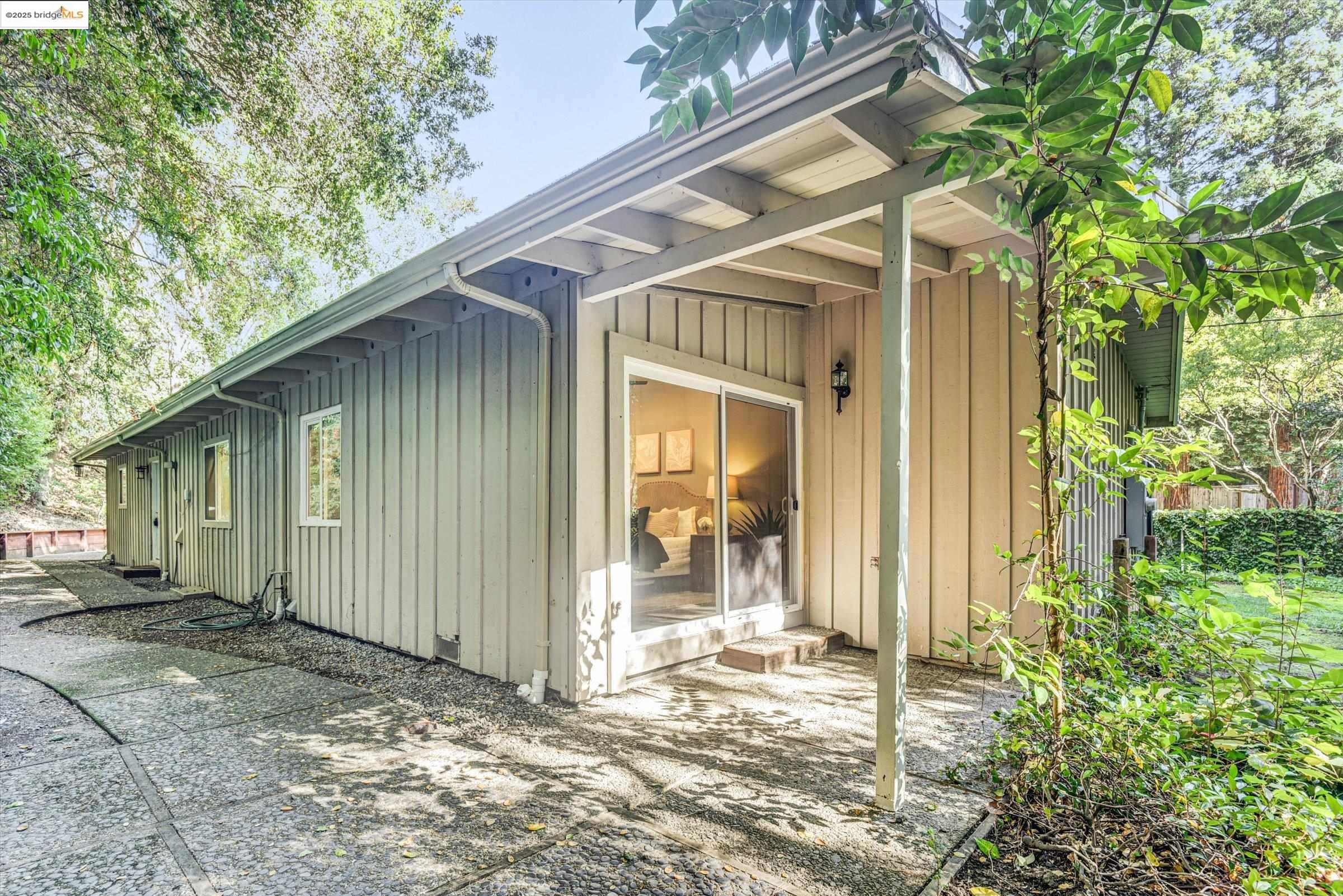 7 St Stephens Drive Orinda, CA 94563 - Photo 5 of 27 a view of a house with a yard