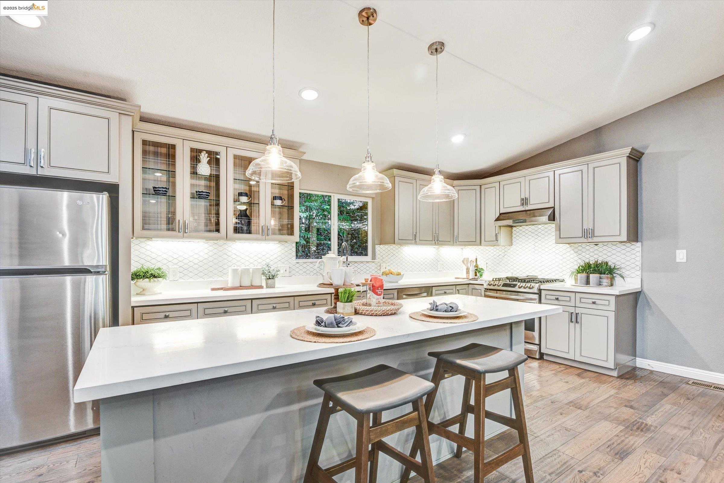 7 St Stephens Drive Orinda, CA 94563 - Photo 8 of 27 a kitchen with a sink stainless steel appliances and cabinets