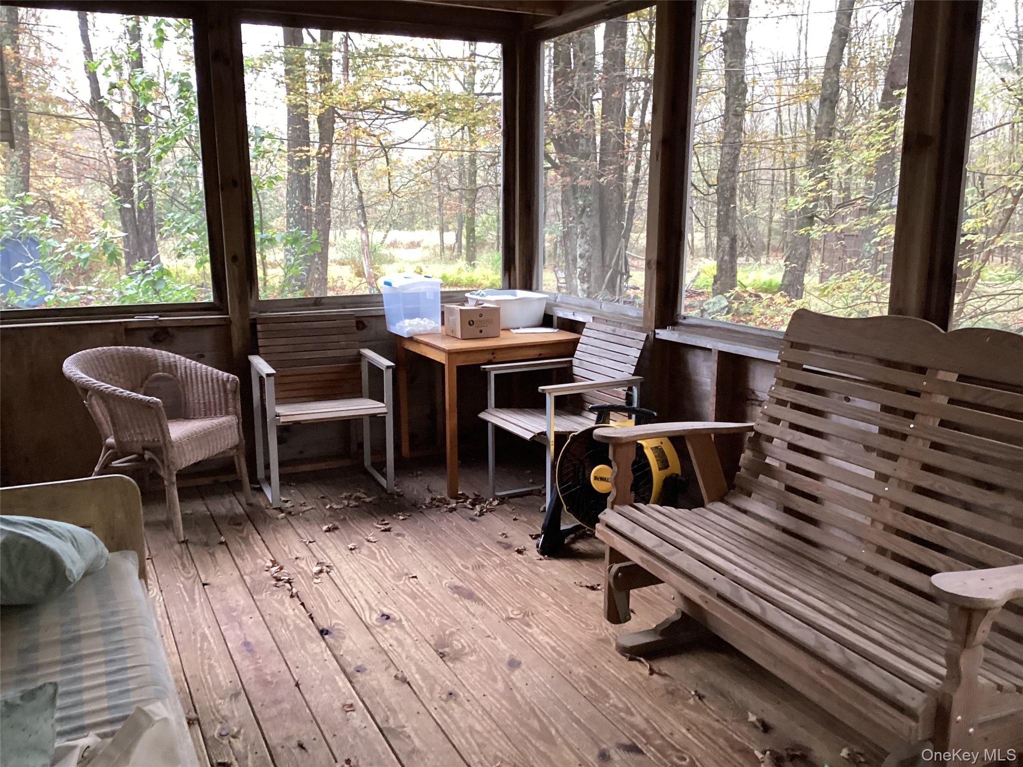 302 Todd Road, Unit T Woodbourne, NY 12788 - Photo 6 of 14 a living room with furniture and a floor to ceiling window